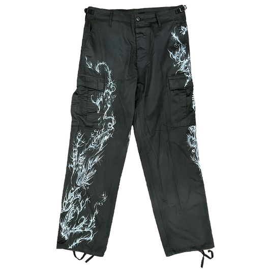 Black cargo pants with white dragon designs on a white background