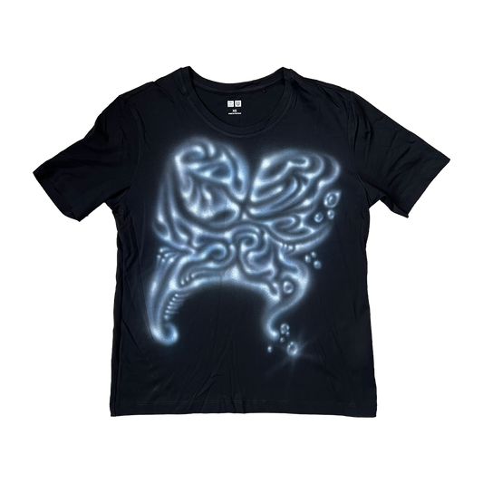 Black t-shirt with a glowing alien head design on a white background