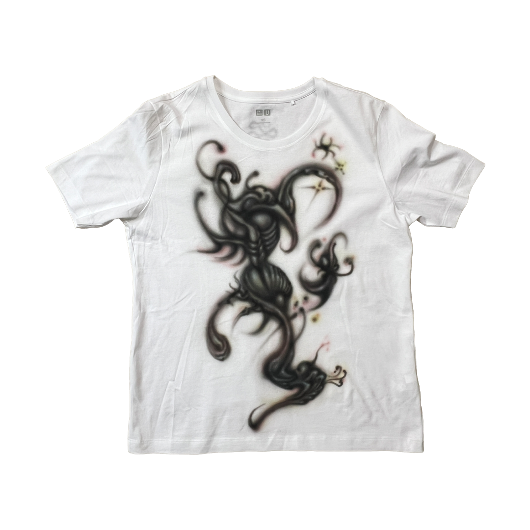 White t-shirt with a black dragon design on a white background