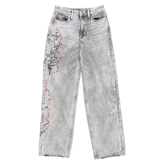 Gray jeans with red floral embroidery on a white background